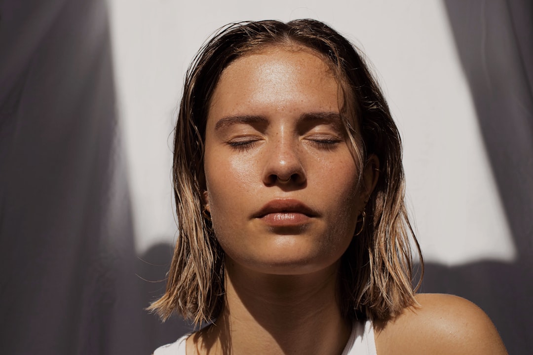 Model with luminous firm skin in soft editorial light